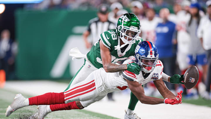 Aug 24, 2024; East Rutherford, New Jersey, USA; New York Jets defensive back Nehemiah Shelton (38) breaks up a pass intended for New York Giants wide receiver Ayir Asante (19) during the second half at MetLife Stadium. Mandatory Credit: Vincent Carchietta-Imagn Images