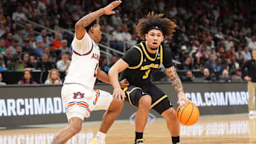 Mar 28, 2025; Atlanta, GA, USA; Michigan Wolverines guard Tre Donaldson (3) dribbles against Auburn Tigers guard Tahaad Pettiford (0) in the first half of a South Regional semifinal of the 2025 NCAA tournament at State Farm Arena. Mandatory Credit: Dale Zanine-Imagn Images