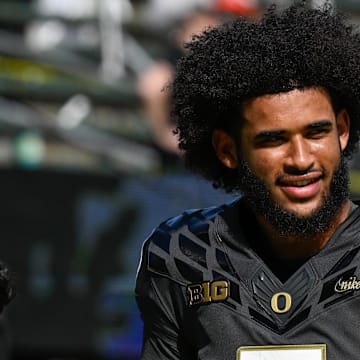 Sep 20, 2025; Eugene, Oregon, USA; Oregon Ducks quarterback Dante Moore (5) warms up before the game against the Oregon State Beavers at Autzen Stadium. Mandatory Credit: Troy Wayrynen-Imagn Images