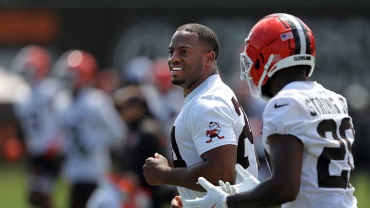 Browns running backs Nick Chubb (left) and Pierre Strong Jr. jog the field during minicamp, Thursday, June 13, 2024, in Berea.
