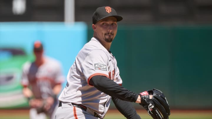 Aug 18, 2024; Oakland, California, USA; San Francisco Giants starting pitcher Blake Snell (7) prepares to throw a pitch against the Oakland Athletics during the first inning at Oakland-Alameda County Coliseum.