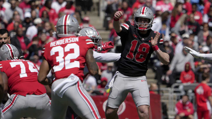 April 13, 2024; Columbus, Ohio, USA; 
Ohio State Buckeyes quarterback Will Howard (18) of the scarlet team throws a pass to running back TreVeyon Henderson (32) during the first half of the LifeSports spring football game at Ohio Stadium on Saturday.