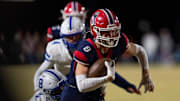 Heritage Hills' Tyler Ruxer (8) runs the ball as the Heritage Hills Patriots play the Batesville Bulldogs during the IHSAA Class 3A football semistate game at Heritage Hills High School in Lincoln City, Ind., Friday, Nov 22, 2024.