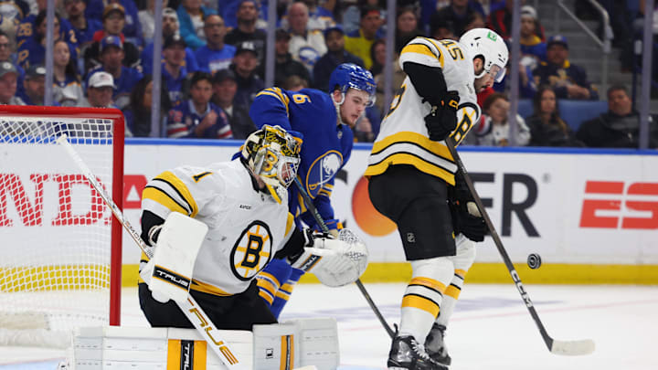 Apr 21, 2026; Buffalo, New York, USA; Buffalo Sabres left wing Zach Benson (6) watches as Boston Bruins defenseman Jonathan Aspirot (45) blocks a shot in front of goaltender Jeremy Swayman (1) during the second period in game two of the first round of the 2026 Stanley Cup Playoffs at KeyBank Center. Mandatory Credit: Timothy T. Ludwig-Imagn Images