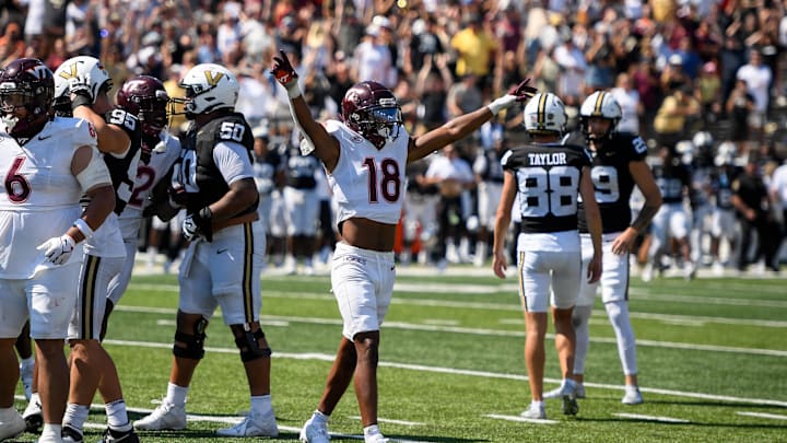 Aug 31, 2024; Nashville, Tennessee, USA;  Virginia Tech Hokies safety Mose Phillips III (18) celebrates the miss from the game tying field goal of Vanderbilt Commodores place kicker Brock Taylor (88) during the second half at FirstBank Stadium. Mandatory Credit: Steve Roberts-USA TODAY Sports