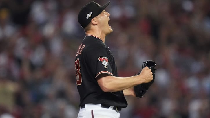 Oct 20, 2023; Phoenix, AZ, USA; Arizona Diamondbacks pitcher Paul Sewald (38) celebrates closing out