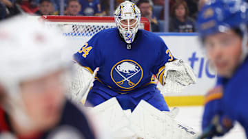 Oct 28, 2025; Buffalo, New York, USA;  Buffalo Sabres goaltender Alex Lyon (34) looks for the puck during the first period against the Columbus Blue Jackets at KeyBank Center. Mandatory Credit: Timothy T. Ludwig-Imagn Images