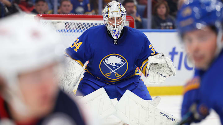 Oct 28, 2025; Buffalo, New York, USA;  Buffalo Sabres goaltender Alex Lyon (34) looks for the puck during the first period against the Columbus Blue Jackets at KeyBank Center. Mandatory Credit: Timothy T. Ludwig-Imagn Images