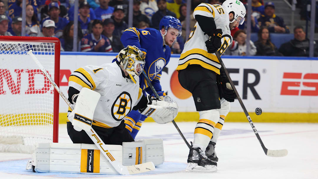 Apr 21, 2026; Buffalo, New York, USA; Buffalo Sabres left wing Zach Benson (6) watches as Boston Bruins defenseman Jonathan Aspirot (45) blocks a shot in front of goaltender Jeremy Swayman (1) during the second period in game two of the first round of the 2026 Stanley Cup Playoffs at KeyBank Center. Mandatory Credit: Timothy T. Ludwig-Imagn Images