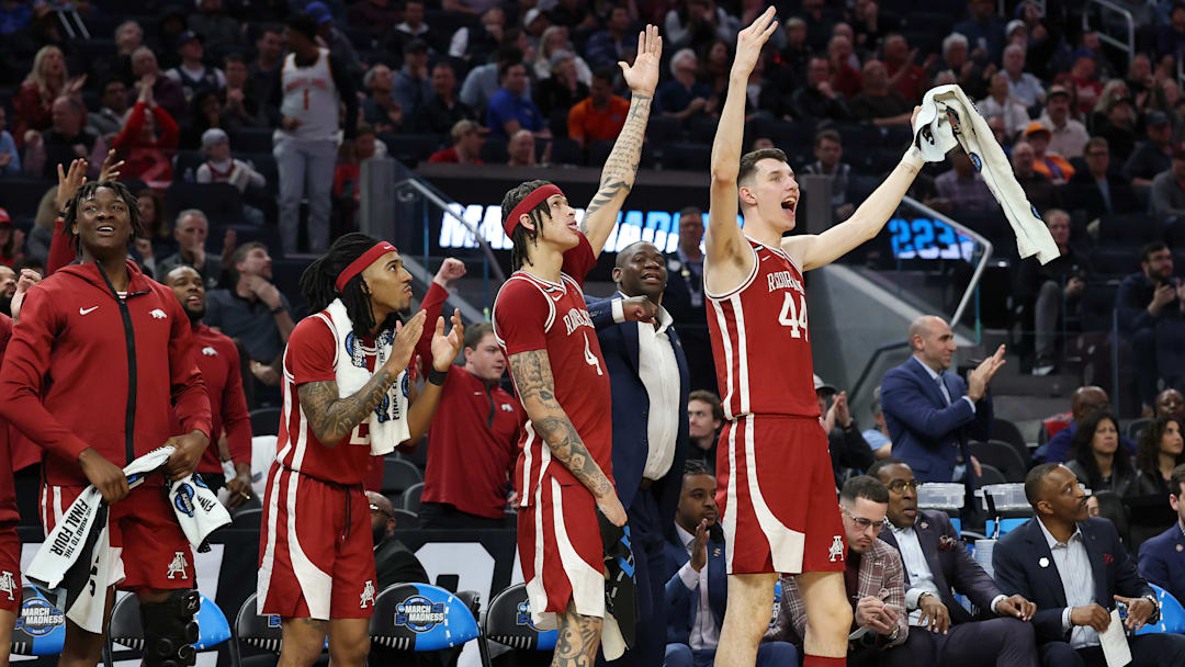 Arkansas Razorbacks (from left) Adou Thiero, Boogie Fland, Trevon Brazile and Zvonimir Ivisic celebrate a moment during Thursday's Sweet 16 match up with Texas Tech in the 2025 NCAA Men's Basketball Tournament. 