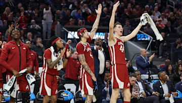 Arkansas Razorbacks (from left) Adou Thiero, Boogie Fland, Trevon Brazile and Zvonimir Ivisic celebrate a moment during Thursday's Sweet 16 match up with Texas Tech in the 2025 NCAA Men's Basketball Tournament. 