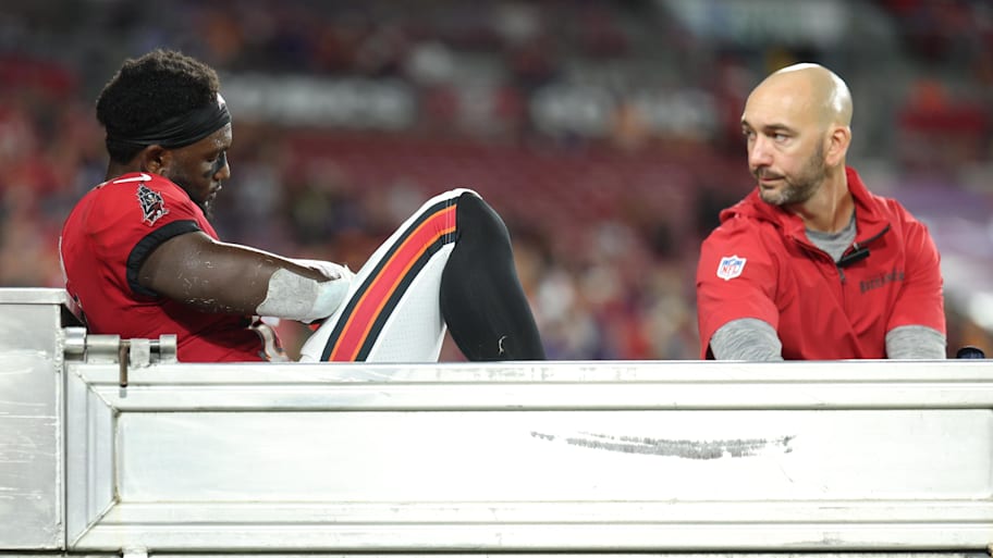 Tampa Bay Buccaneers wide receiver Chris Godwin is carted off the field against the Baltimore Ravens. | Nathan Ray Seebeck-Imagn Images