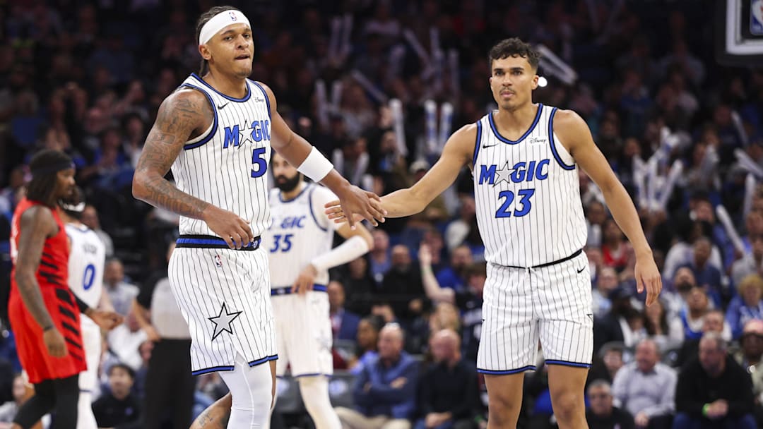Nov 10, 2025; Orlando, Florida, USA; Orlando Magic forward Paolo Banchero (5) and forward Tristan da Silva (23) react after a play against the Portland Trail Blazers in the third quarter at Kia Center. Mandatory Credit: Nathan Ray Seebeck-Imagn Images