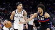 Mar 1, 2025; Detroit, Michigan, USA;  Brooklyn Nets guard Killian Hayes (7) dribbles defended by Detroit Pistons guard Cade Cunningham (2) in the first half at Little Caesars Arena. Mandatory Credit: Rick Osentoski-Imagn Images