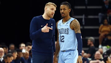 Mar 31, 2025; Memphis, Tennessee, USA; Memphis Grizzlies interim head coach Tuomas Iisalo talks with Memphis Grizzlies guard Ja Morant (12) during the third quarter against the Boston Celtics at FedExForum. Mandatory Credit: Petre Thomas-Imagn Images