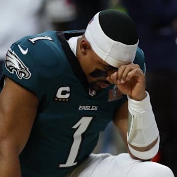Feb 9, 2025; New Orleans, LA, USA; Philadelphia Eagles quarterback Jalen Hurts (1) kneels in the end zone prior to Super Bowl LIX  against the Kansas City Chiefs at Caesars Superdome. 