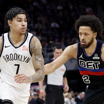 Mar 1, 2025; Detroit, Michigan, USA;  Brooklyn Nets guard Killian Hayes (7) dribbles defended by Detroit Pistons guard Cade Cunningham (2) in the first half at Little Caesars Arena. Mandatory Credit: Rick Osentoski-Imagn Images