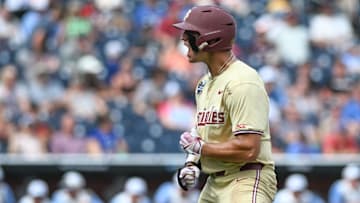Jun 18, 2024; Omaha, NE, USA;  Florida State Seminoles center fielder Max Williams (18) reacts after hitting a home run against the North Carolina Tar Heels during the ninth inning at Charles Schwab Field Omaha. Mandatory Credit: Steven Branscombe-Imagn Images