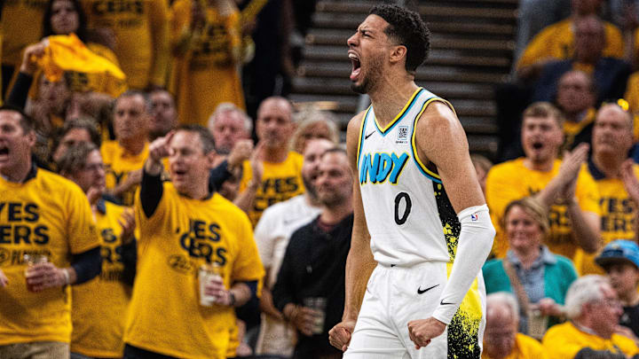 Apr 29, 2025; Indianapolis, Indiana, USA; Indiana Pacers guard Tyrese Haliburton (0) reacts during a time out during game five of the first round for the 2024 NBA Playoffs against the Milwaukee Bucks at Gainbridge Fieldhouse. Mandatory Credit: Trevor Ruszkowski-Imagn Images