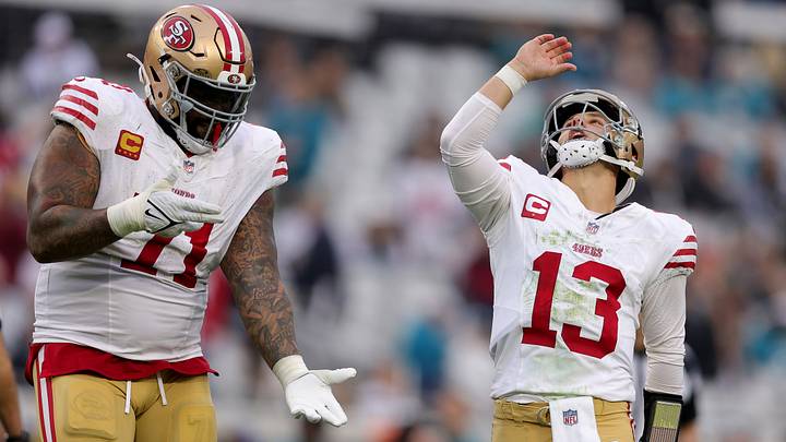 San Francisco 49ers left tackle Trent Williams (L) and quarterback Brock Purdy (R)