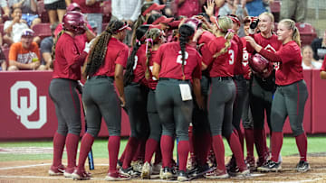 Freshman catcher Kendall Wells hits a home run during the game against Oklahoma Christian University at Love’s Field on Wednesday in Norman, Okla.