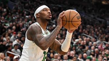 Feb 12, 2025; Boston, Massachusetts, USA; Boston Celtics forward Torrey Craig (12) takes a three-point basket against the San Antonio Spurs during the second quarter at the TD Garden. Mandatory Credit: Brian Fluharty-Imagn Images