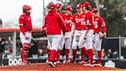Nebraska baseball players meet on the mound during a game against Louisiana on Feb. 22, 2025.