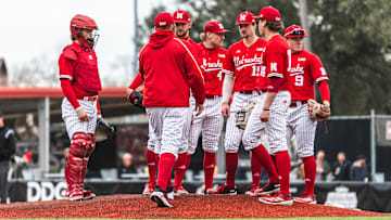 Nebraska baseball players meet on the mound during a game against Louisiana on Feb. 22, 2025.