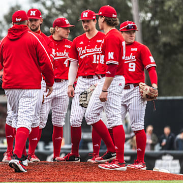 Nebraska baseball players meet on the mound during a game against Louisiana on Feb. 22, 2025.