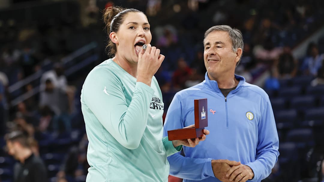 Jul 29, 2022; Chicago, Illinois, USA; New York Liberty center Stefanie Dolson (L) reacts as she receives 2021 WNBA Championship Ring from Chicago Sky owner Michael Alter (R) before the WNBA game between the Chicago Sky and New York Liberty at Wintrust Arena. Mandatory Credit: Kamil Krzaczynski-Imagn Images