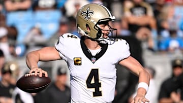 Nov 3, 2024; Charlotte, North Carolina, USA; New Orleans Saints quarterback Derek Carr (4) looks to pass in the third quarter at Bank of America Stadium. Mandatory Credit: Bob Donnan-Imagn Images