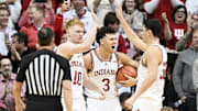 Indiana's Luke Goode (10), Anthony Leal (3) and Trey Galloway (32) celebrate against Purdue at Simon Skjodt Assembly Hall.