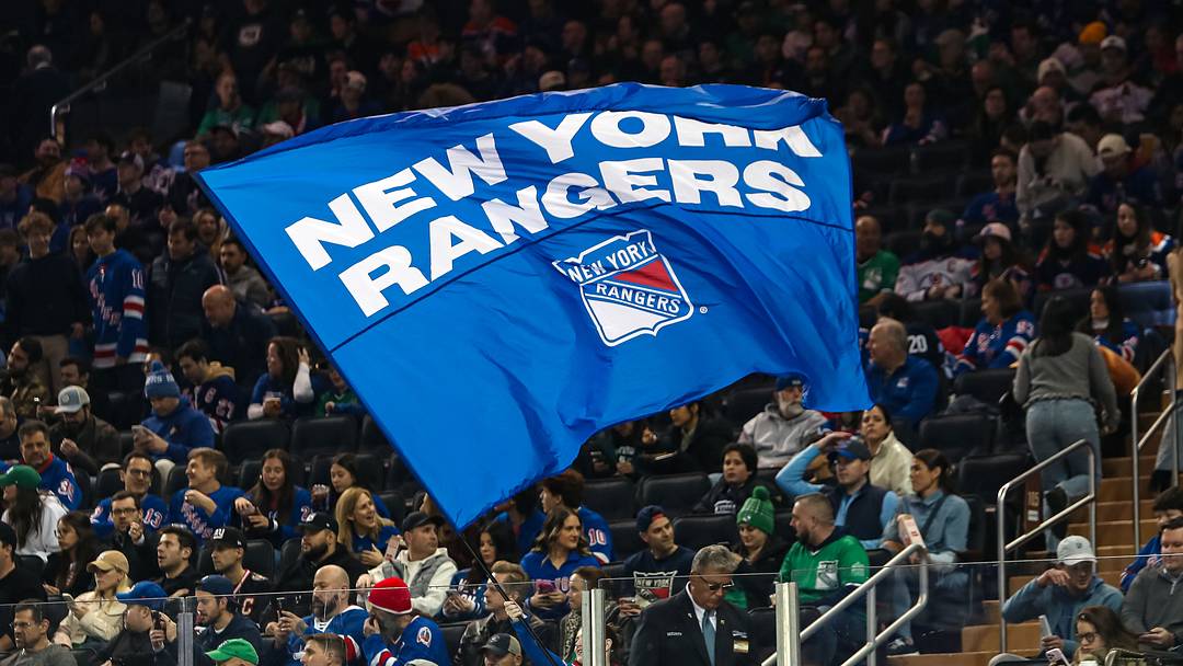 Mar 16, 2025; New York, New York, USA; A New York Rangers flag is seen in the crown during the first period against the Edmonton Oilers at Madison Square Garden. 