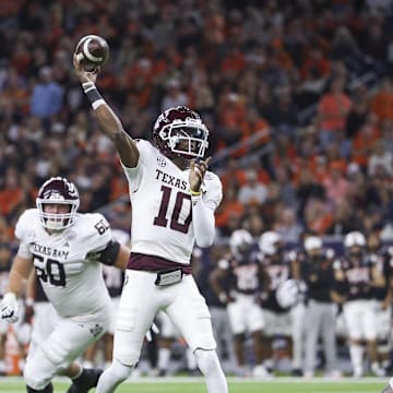 Dec 27, 2023; Houston, TX, USA; Texas A&M Aggies quarterback Marcel Reed (10) passes the ball during the third quarter against the Oklahoma State Cowboys at NRG Stadium. Mandatory Credit: Troy Taormina-Imagn Images