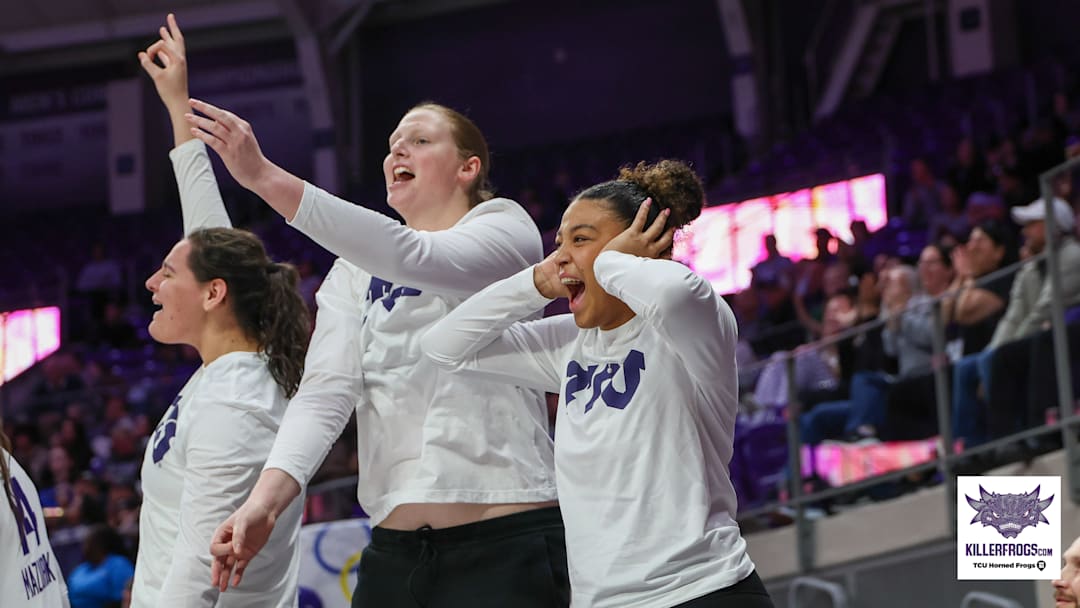 TCU women's basketball players celebrate during a game. 