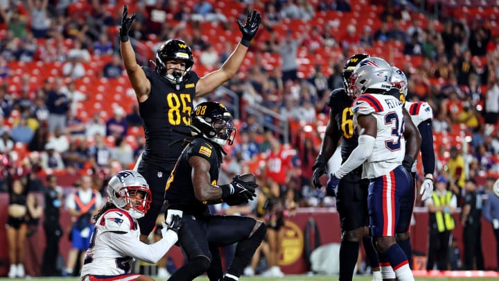 Aug 25, 2024; Landover, Maryland, USA; Washington Commanders wide receiver Martavis Bryant (88) scores a touchdown against New England Patriots safety Joshuah Bledsoe (24) during the fourth quarter during a preseason game at Commanders Field. Mandatory Credit: Peter Casey-USA TODAY Sports