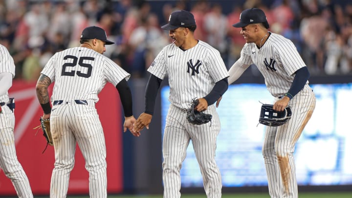 Jun 18, 2024; Bronx, New York, USA; New York Yankees second baseman Gleyber Torres (25) and right fielder Juan Soto (22) and centerfielder Trent Grisham (12) celebrate after defeating the Baltimore Orioles at Yankee Stadium. Mandatory Credit: Vincent Carchietta-USA TODAY Sports
