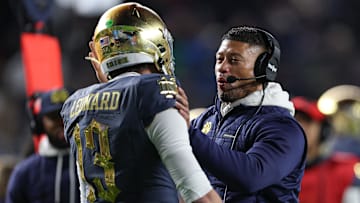 Nov 23, 2024; New York, New York, USA; Notre Dame Fighting Irish head coach Marcus Freeman celebrates with quarterback Riley Leonard (13) after a touchdown during the first half against the Army Black Knights at Yankee Stadium. Mandatory Credit: Vincent Carchietta-Imagn Images