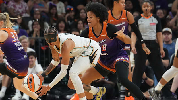 A photo of Monique Akoa Makani guarding Natasha Clou