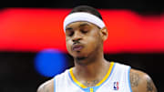Feb 7, 2011; Denver, CO, USA; Denver Nuggets small forward Carmelo Anthony (15) reacts with 5.3 seconds left in the fourth quarter against the Houston Rockets at the Pepsi Center. The Rockets defeated the Nuggets 108-103. Mandatory Credit: Ron Chenoy-Imagn Images
