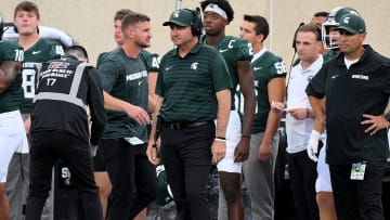 Aug 30, 2024; East Lansing, Michigan, USA;  New Michigan State Spartans head coach Jonathan Smith watches from the sidelines during the game against the Florida Atlantic Owls at Spartan Stadium. Mandatory Credit: Dale Young-USA TODAY Sports