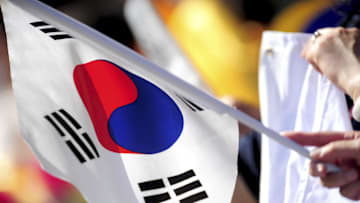 South Williamsport, PA, USA; A fan holds a Korean flag during the game between the Asia-Pacific Region and the Great Lakes Region at Howard J. Lamade Stadium.