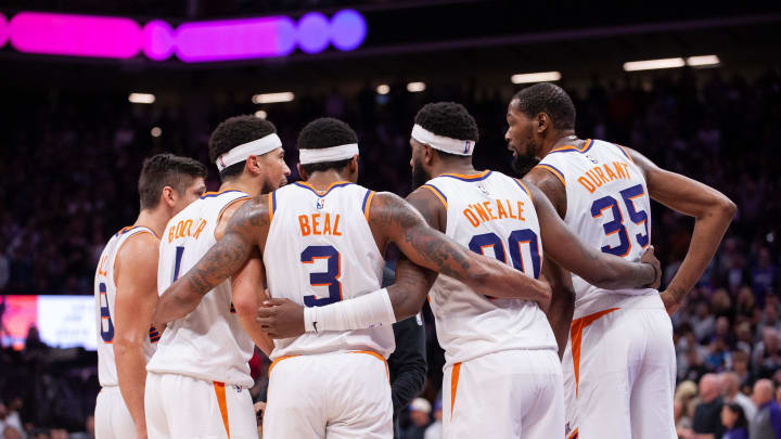 Apr 12, 2024; Sacramento, California, USA; Phoenix Suns guard Grayson Allen (8) and guard Devin Booker (1) and guard Bradley Beal (3) and forward Royce O'Neale (00) and forward Kevin Durant (35) huddle up before the final seconds of the fourth quarter at Golden 1 Center. Mandatory Credit: Ed Szczepanski-USA TODAY Sports