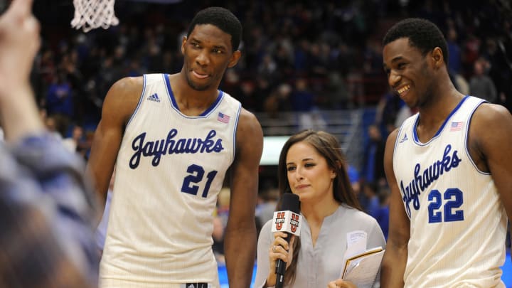 Feb 22, 2014; Lawrence, KS, USA; Kansas Jayhawks center Joel Embiid (21) and guard Andrew Wiggins (22) speak with media after the game against the Texas Longhorns at Allen Fieldhouse. Kansas won 85-54. 