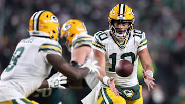 Jan 12, 2025; Philadelphia, Pennsylvania, USA; Green Bay Packers quarterback Jordan Love (10) pitches the ball against the Philadelphia Eagles during the third quarter in an NFC wild card game at Lincoln Financial Field.