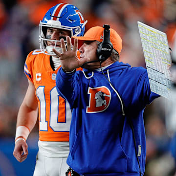 Nov 6, 2025; Denver, Colorado, USA; Denver Broncos quarterback Bo Nix (10) talks with head coach Sean Payton in the fourth quarter against the Las Vegas Raiders at Empower Field at Mile High. Mandatory Credit: Isaiah J. Downing-Imagn Images