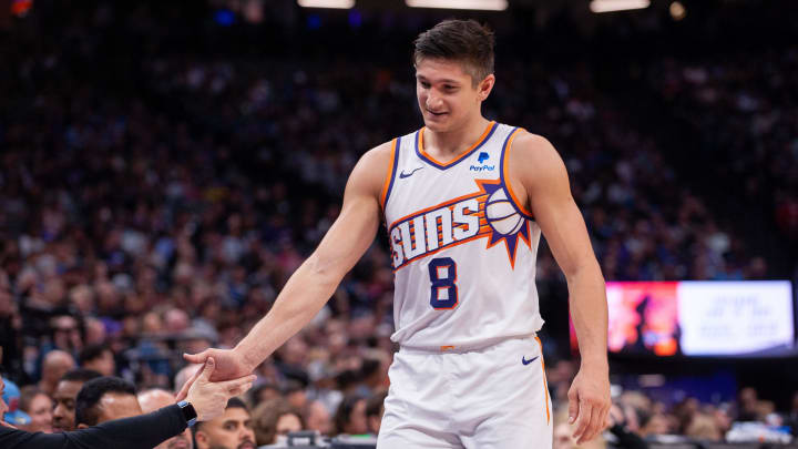 Apr 12, 2024; Sacramento, California, USA; Phoenix Suns guard Grayson Allen (8) high fives coaches as he comes out of the game during the second quarter at Golden 1 Center. Mandatory Credit: Ed Szczepanski-USA TODAY Sports