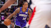Jan 19, 2025; Sacramento, California, USA; Sacramento Kings forward DeMar DeRozan (10) controls the ball against the Washington Wizards during the second quarter at Golden 1 Center. Mandatory Credit: Ed Szczepanski-Imagn Images