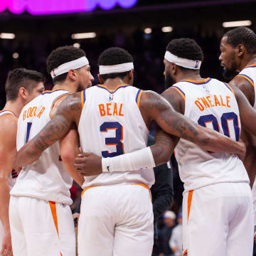 Apr 12, 2024; Sacramento, California, USA; Phoenix Suns guard Grayson Allen (8) and guard Devin Booker (1) and guard Bradley Beal (3) and forward Royce O'Neale (00) and forward Kevin Durant (35) huddle up before the final seconds of the fourth quarter at Golden 1 Center. Mandatory Credit: Ed Szczepanski-USA TODAY Sports