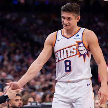 Apr 12, 2024; Sacramento, California, USA; Phoenix Suns guard Grayson Allen (8) high fives coaches as he comes out of the game during the second quarter at Golden 1 Center. Mandatory Credit: Ed Szczepanski-Imagn Images